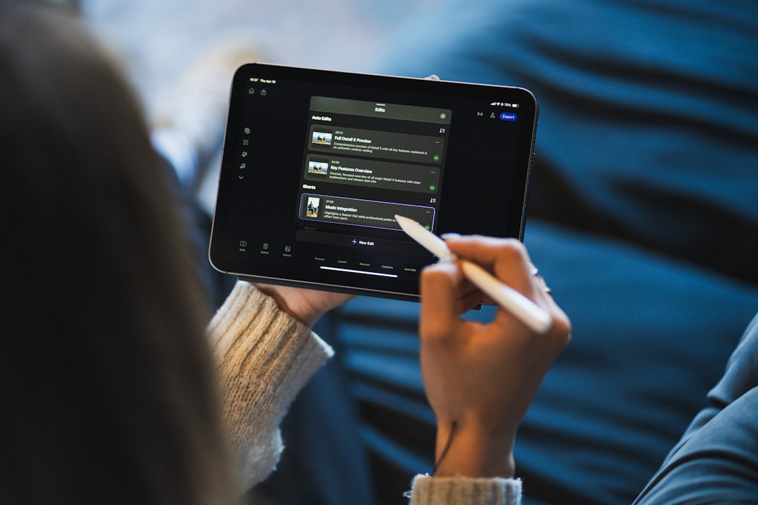 Person using a stylus on a tablet screen