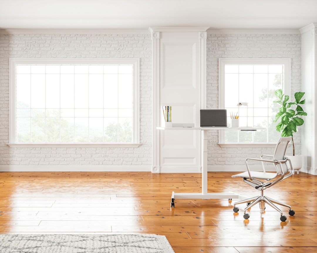 A 3D rendered modern home office with a laptop displaying a glowing abstract holographic interface in the air above the keyboard, surrounded by soft bokeh light particles, morning sunlight, cozy creative workspace aesthetic, lavender and teal accent lighting, ultra detailed Pixar-quality render, 8K, absolutely no text, no letters, no words, no numbers, no writing, no watermark, no logo