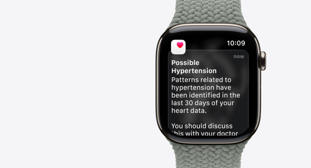 애플워치 시리즈 12 - Apple Watch health app hypertension notification on watch face, close-up product photo